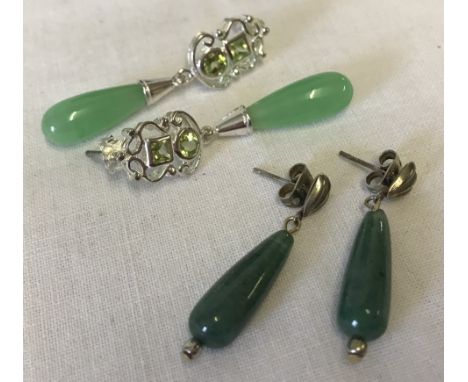 2 pairs of jade drop style earrings. One pair set with peridot stones to top. 