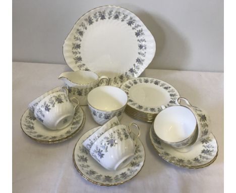 A 6 setting Minton ceramic tea set in "Alpine Spring" pattern. Comprising; 6 cups & saucers, 6 tea plates, cake plate, sugar 