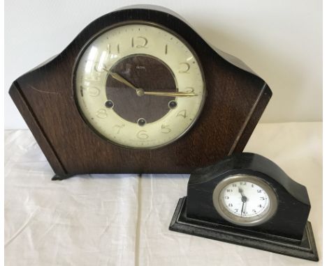 A vintage Smiths wooden cased mantle clock with key. Together with a small wooden cased wind up mantle clock. 