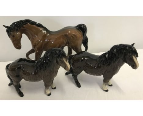 3 Royal Doulton ceramic horse figurines in brown gloss finish. "Spirit of Freedom" #DA58A (ear has been repaired) together wi