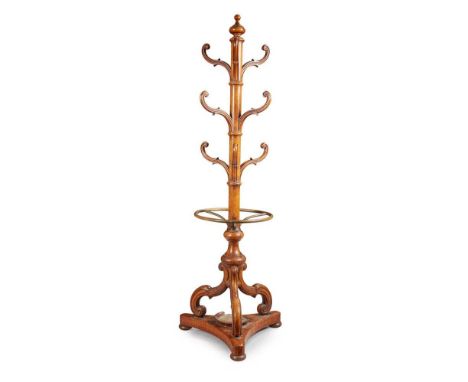 The central column with a turned finial and issuing nine scrolled arms, on a circular base fitted with a brass rail192cm high