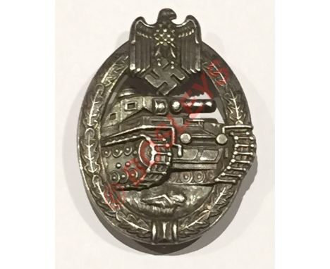 German Third Reich WW2 Army / Waffen SS Panzer Assault Badge.A good die-stamped silvered example. Approaching Panzer within a