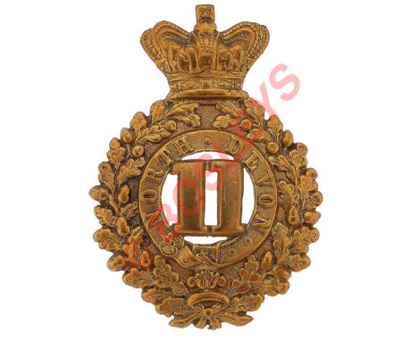 11th (North Devon) Regiment of Foot Victorian OR's glengarry badge circa 1874-81.A good brass example. Crowned oak wreath; to