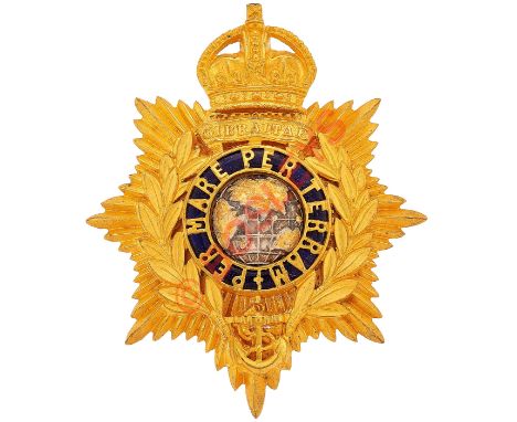 Royal Marines Warrant Officer's helmet plate circa 1905-39.A scarce rich gilt example. Crowned star mounted with laurel wreat