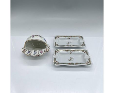 Three porcelain ashtrays decorated with colorful flowers. Two are rectangular, stamped Bernardaud Limoges France; 5"L x 3.25"