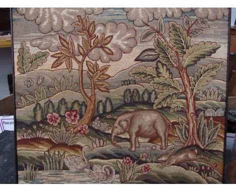 An Arts & Crafts textile panel depicting an elephant, swans and hare in tree lined landscape. 42cm x 48cm