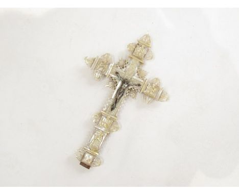 A highly decorative mother of pearl veneered olive wood crucifix with carved and pierced detail, marked "Jerusalem" on the ba