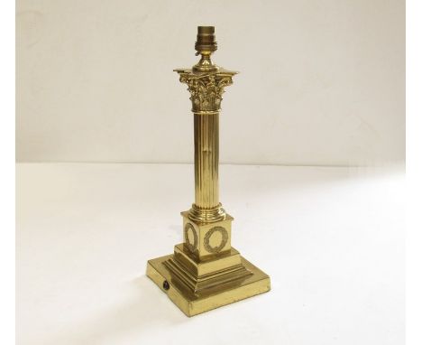 A Victorian brass corinthian column table lamp base needs re-wiring 