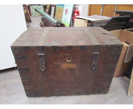 A 19th Century oak silver chest with metal strapping and twin wrought metal carrying handles.  the lid opens to reveal a line