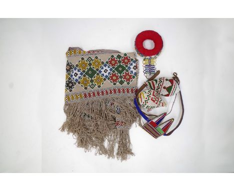 Five items of beadwork to include a North American Indian panel with fringing 