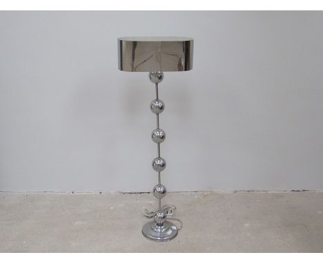 An early 20th Century American chrome and plated floor lamp with six ball and rod column, base needs tightening.  110cm tall