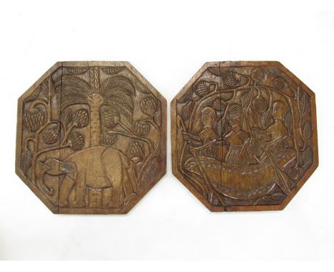 Two carved Indonesian octagonal panels, elephant and natives in canoe, 45cm x 45cm