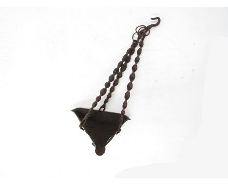 An 18th century right metal hanging whale oil lamp with twisted supports 
