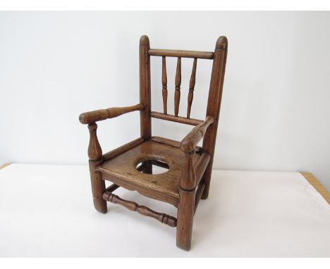 A Georgian elm childs commode chair, 56cm tall x 34cm wide 