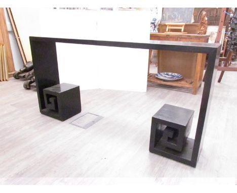 A Chinese black lacquered long slender side table with Greek key shaped display shelf feet. 170cm long 