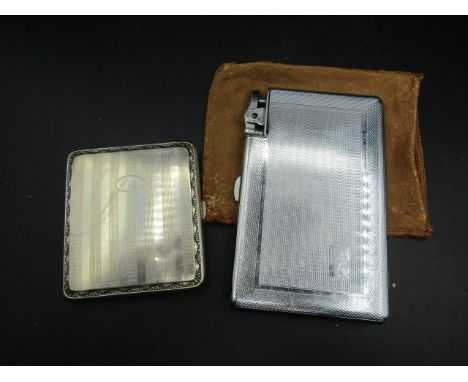 2 cigarette cases, 1 by Moda with integrated lighter