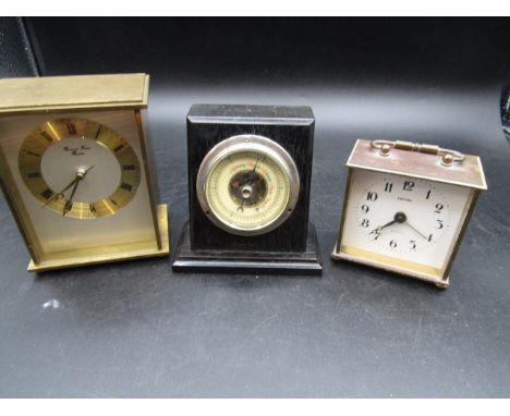 2 brass carriage clocks and a small barometer set in wooden plinth