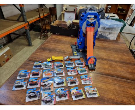 Mattel Hot Wheels Mega Garage 2 Trucks 22 blister pack cars  Great lot, the garage has a handle on the back which elevates th
