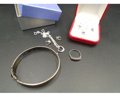 A Silver hallmarked hinged bangle - London 1971 by Fred Manshaw Ltd 25g. Two Silver 925 boxed earring and necklace sets and a