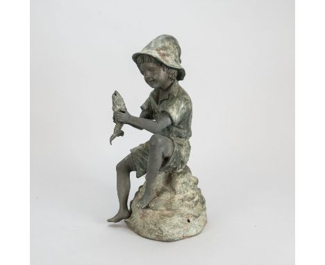 A boy with a fish. The open mouth of the fish with pipe for spending water. Bonze cast with original patina lightly weathered