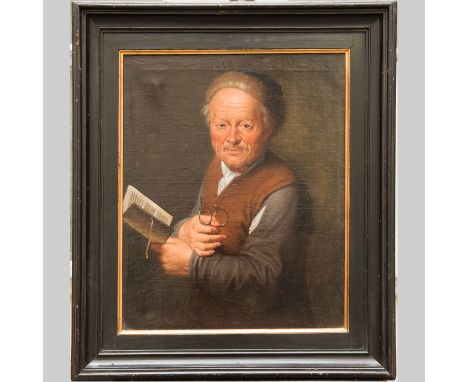 Portrait of a man with eye glasses, a book and fur cap. Oil on canvas. Framed. 64 x 53 cm.