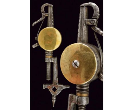 dating: 17th Century provenance: Europe, In iron, powder flask walls with brass disks, chiselled fuse with spring closing, bo