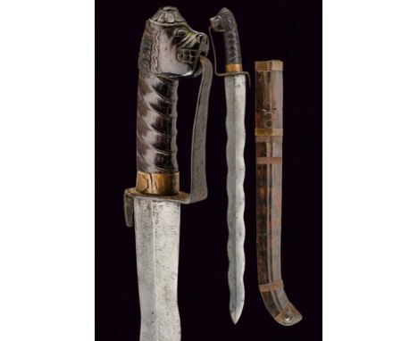 dating: 19th Century provenance: Indonesia, Straight, undulated double-edged blade, wooden, embossed grip, the pommel shaped 