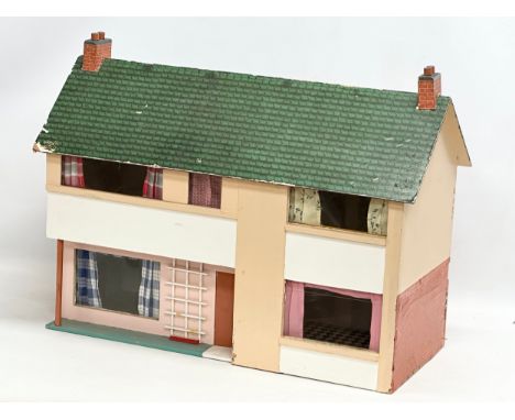 A vintage dolls house. 62x27x50cm 