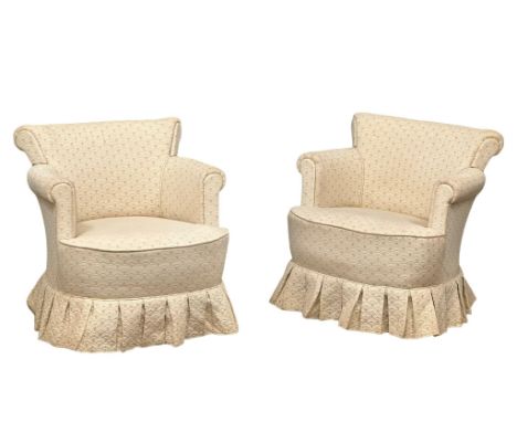 A pair of vintage tub chairs. 