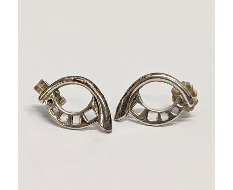 A pair of silver earrings 