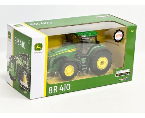 An unused Prestige Collection Britains ‘John Deere’ 8R 410 tractor in box. 1/32 scale. 30x13x15cm 