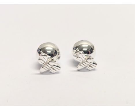 A pair of silver earrings 