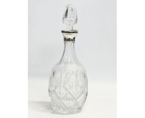 A silver mounted crystal decanter. 30.5cm 