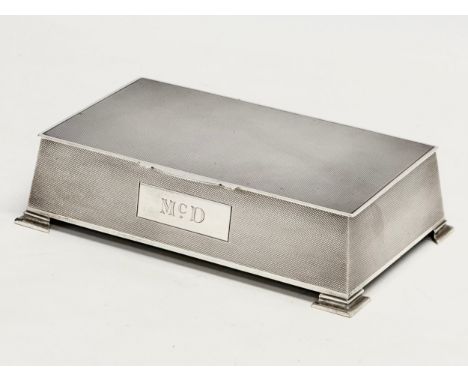 A large silver cigarette case. Birmingham, 1946. Wooden interior. 18x11x5cm 