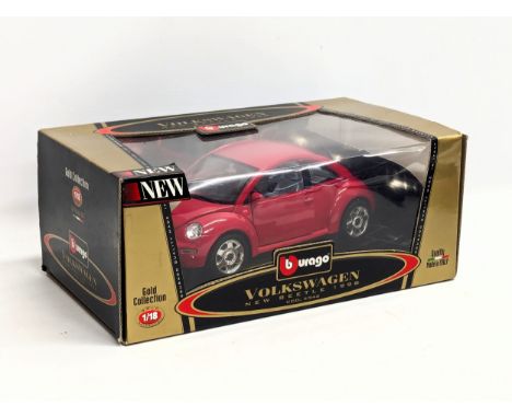 A Burago Gold Collection Volkswagen New Beetle 1998 in box. 1/18 scale. Box measures 30x18.5x13cm 