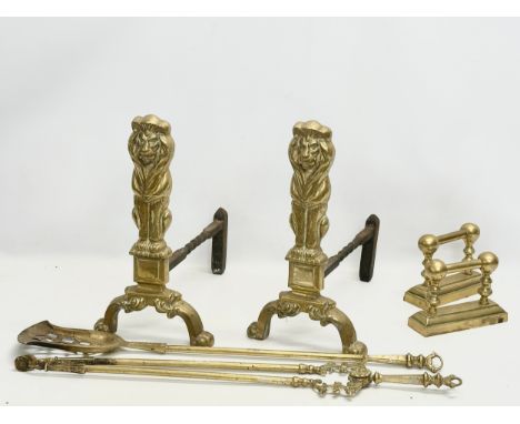 A set of large good quality early 20th century brass fire andirons and tools. 24x41x44cm 