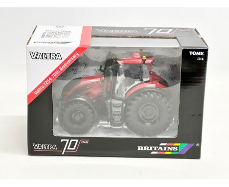 An unused Britains Valtra TZ54 70th Anniversary tractor in box. 22.5x12.5x14.5cm 