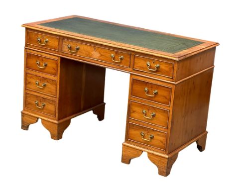 A vintage Georgian style Yew Wood pedestal writing desk with leather top. 122x61x79cm 