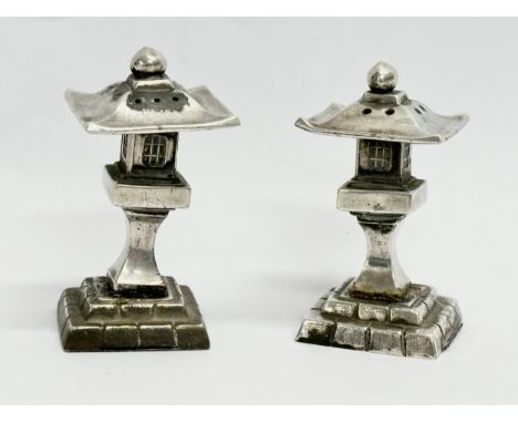 A pair of novelty pagoda style silver condiments. Stamped 950. 62.5 grams. 