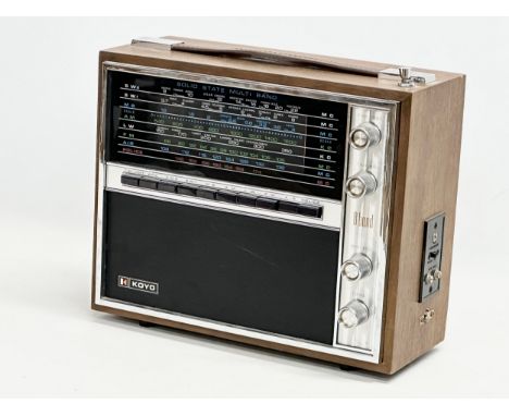 A vintage Koyo Solid State Multi Band Radio. Model KTR-1661. 