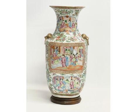 A large late 19th century Chinese Tongzhi Famille Rose vase with gilt Foo Dog, ring handle moulding and Greek Key decoration.