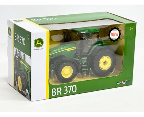 An unused Britains John Deere 8R 370 tractor in box. 26.5x13x15cm 