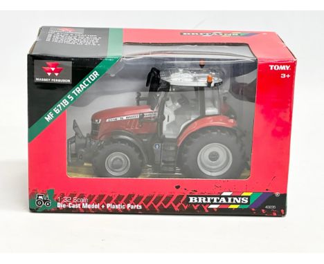 An unused Britains MF 6718 S Tractor in box. 1:32 scale. Die-Cast Model and Plastic Parts. 22x11x14cm 