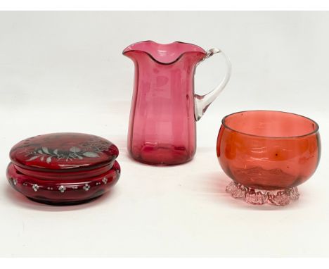 3 pieces of late 19th century Cranberry and Ruby Glass. Jug measures 14x15cm 