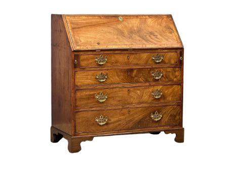 A George III mahogany writing bureau with original brass drop handles and 3 drawers on bracket feet. Circa 1800. 96.5x47x104.