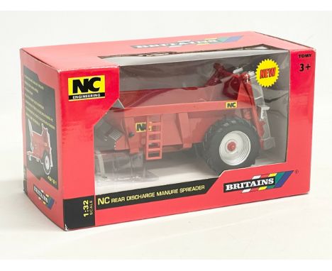 An unused Britains NC Engineering NC Discharge Manure Spreader in box. 1:32 scale. 25x12x14cm 