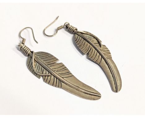 A pair of silver earrings 