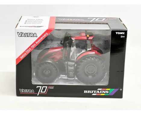 An unused Britains Valtra TZ54 70th Anniversary tractor in box. 22.5x12.5x14.5cm 