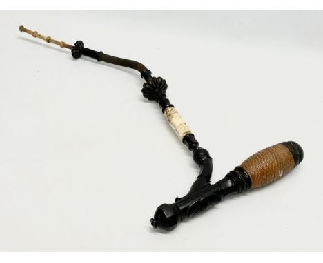 A large early 20th century bone, horn and wooden pipe. 59cm 