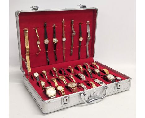 A collection of vintage ladies and gents watches in case 